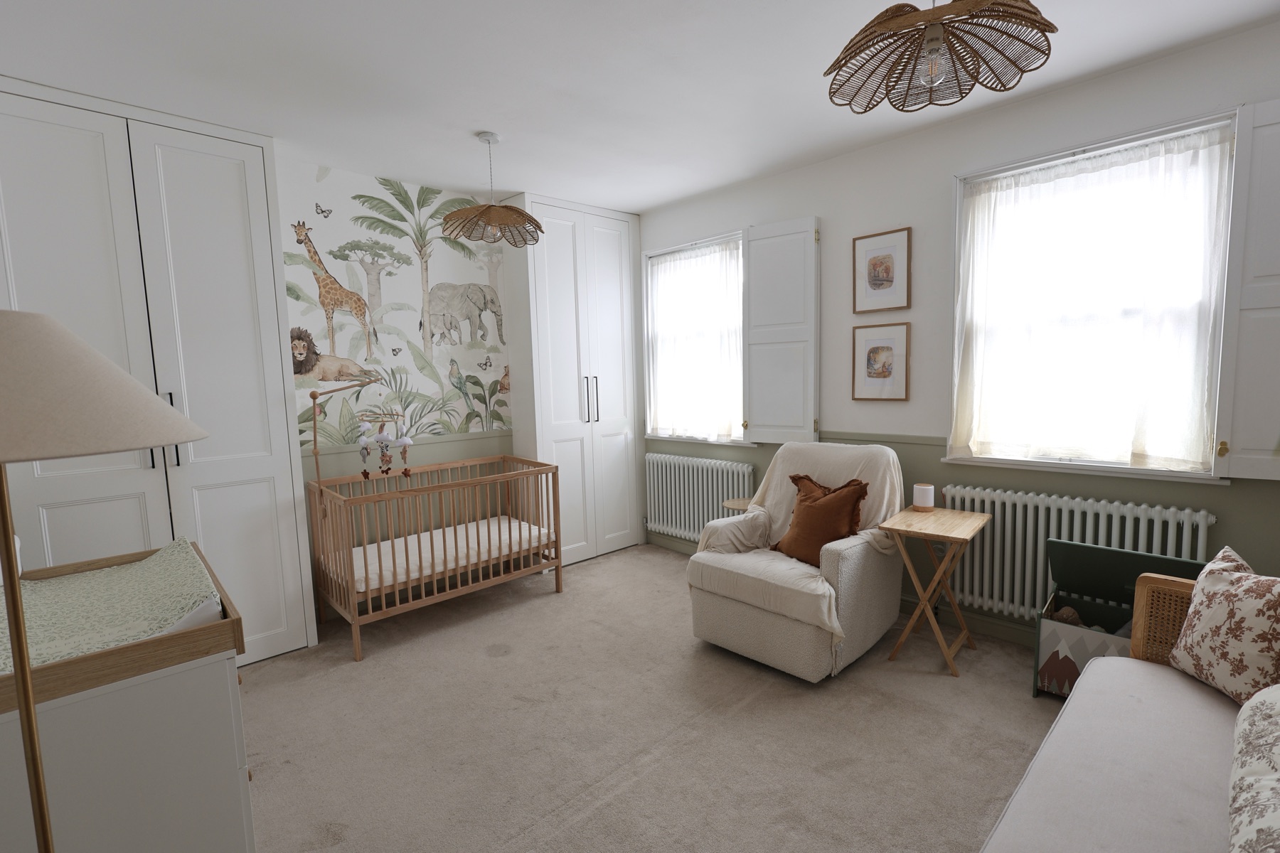 The bright baby room with its cot and comfortable seating