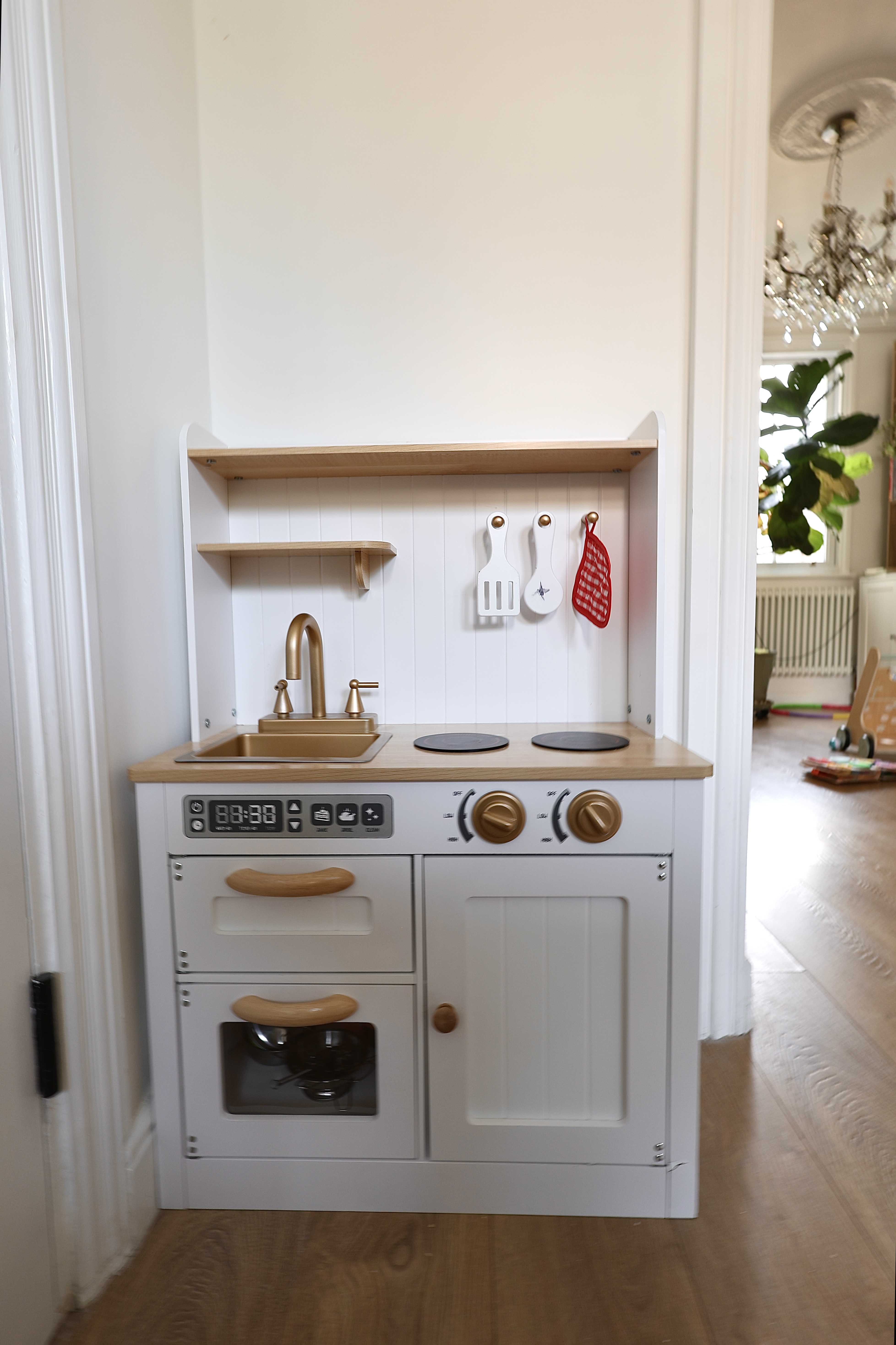 A close view of the children's play kitchen in the Root and Bloom main area