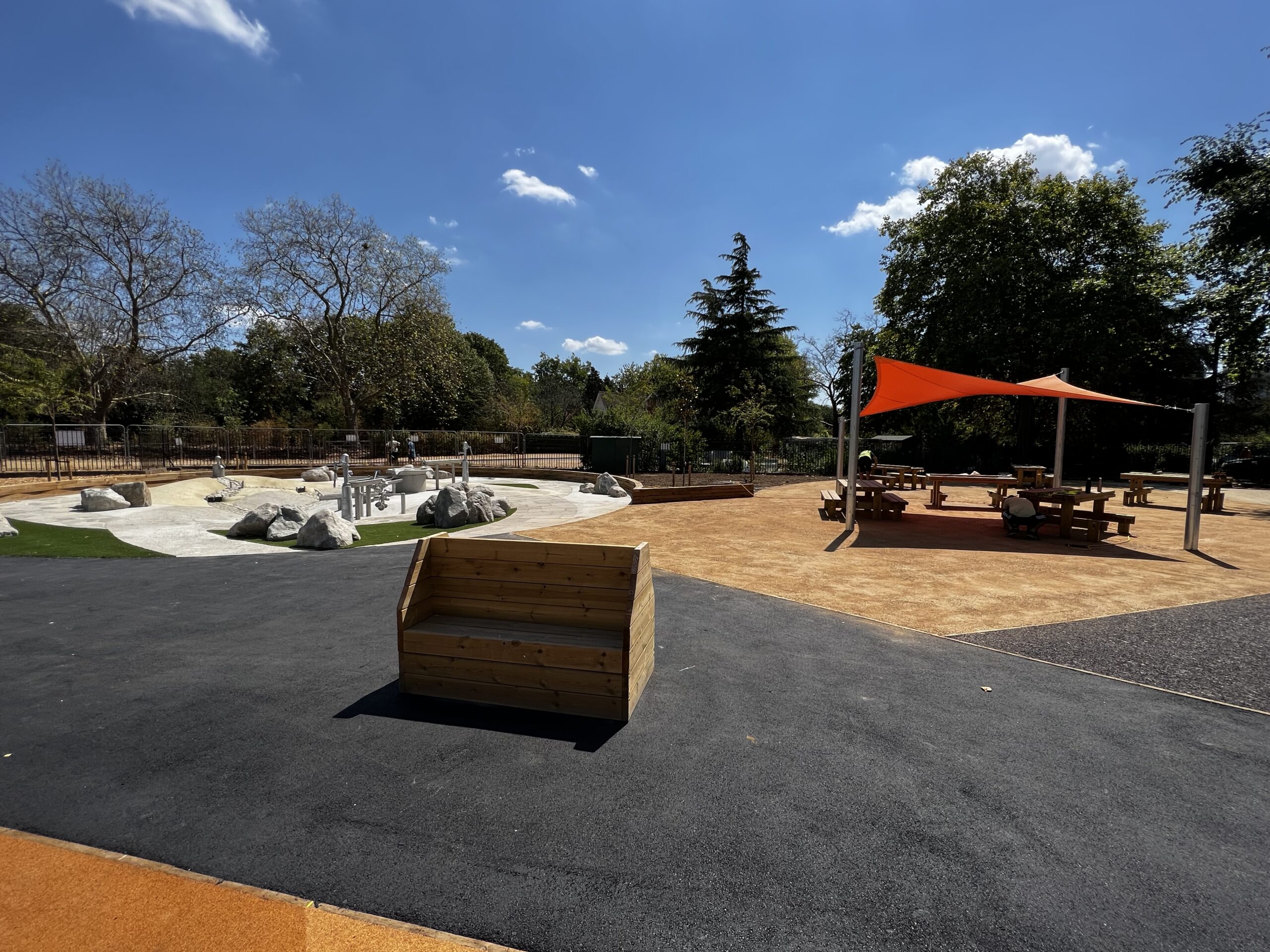 A wide view of the playground and water play area in West Ham Park